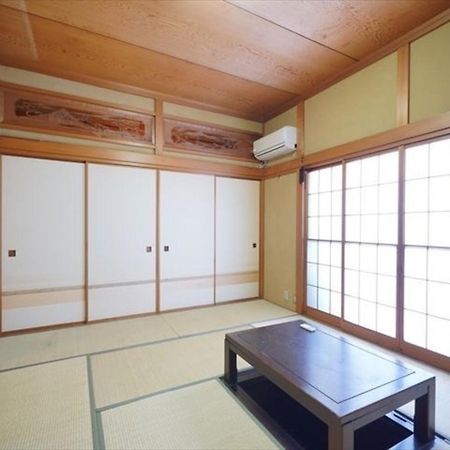 海と駅の近くのゲストハウス海悠 Ито Экстерьер фото